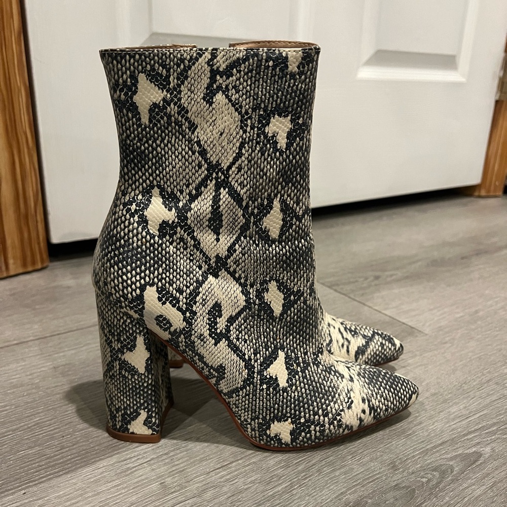 Black and white snakeskin boots from Pretty Little Thing